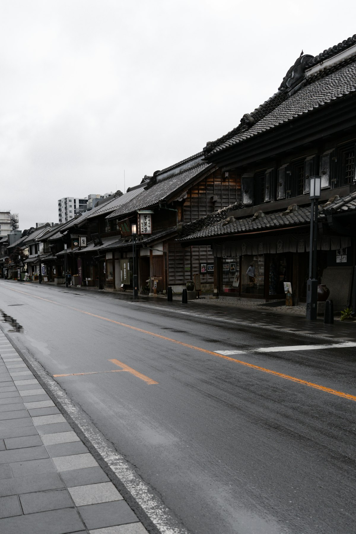 A quiet street lined with traditional Japanese buildings in Kawagoe, Saitama