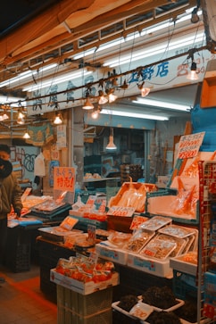 A japanese seafood market filled with fresh products.