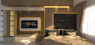 A luxurious bedroom with a TV and bed.