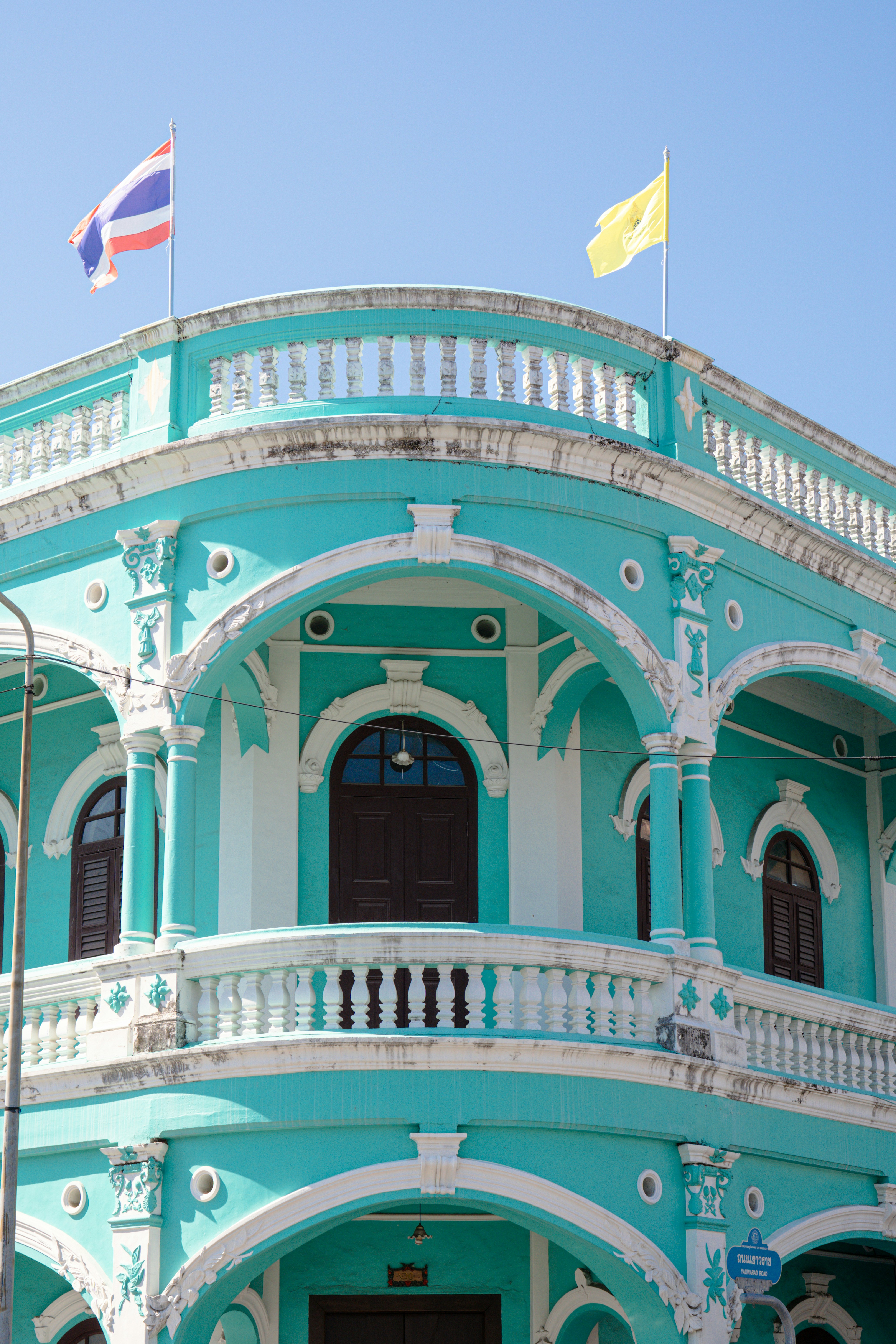 A beautiful, turquoise building with thai flags. photo – Free Building ...