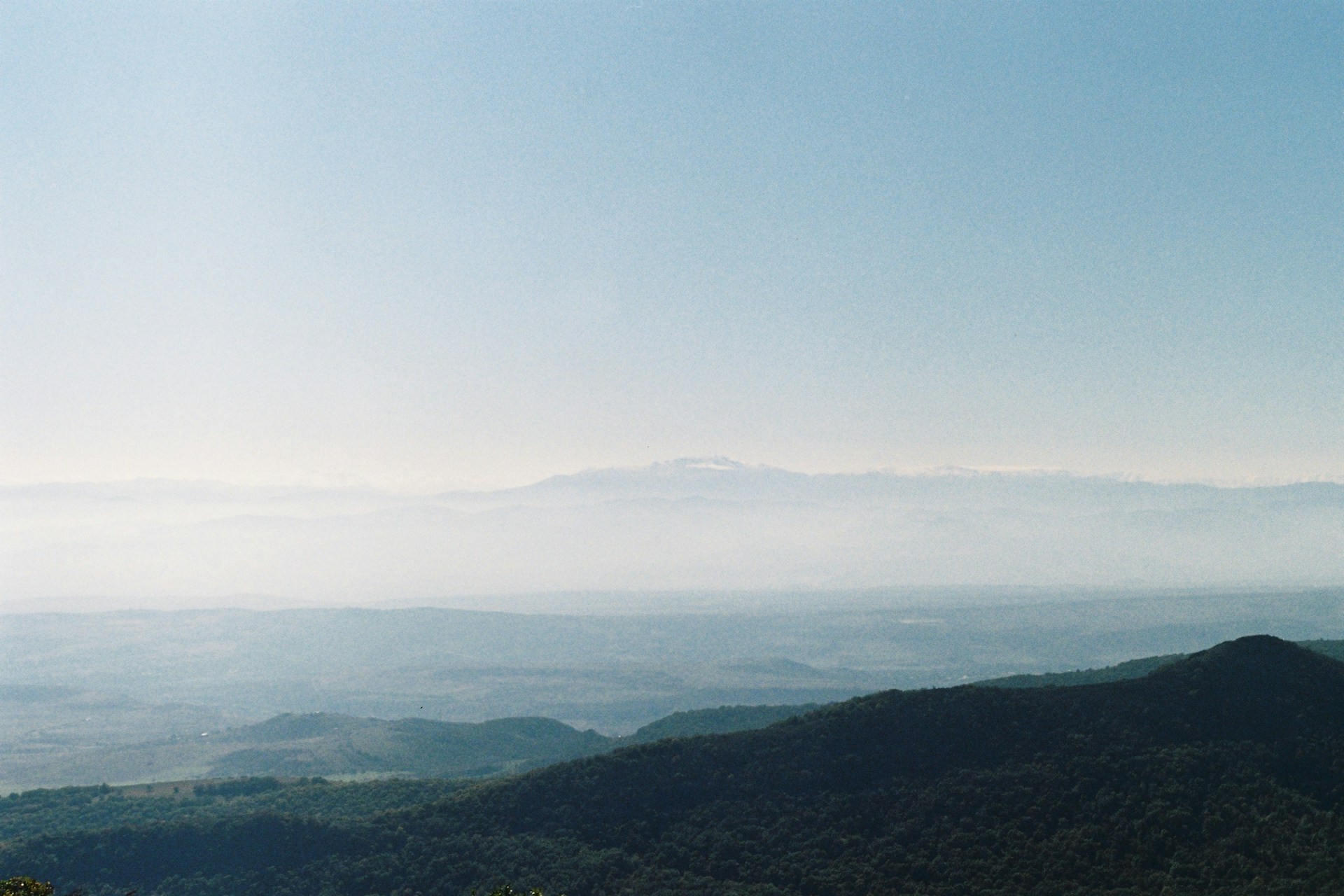 A view of a mountain range from a distance