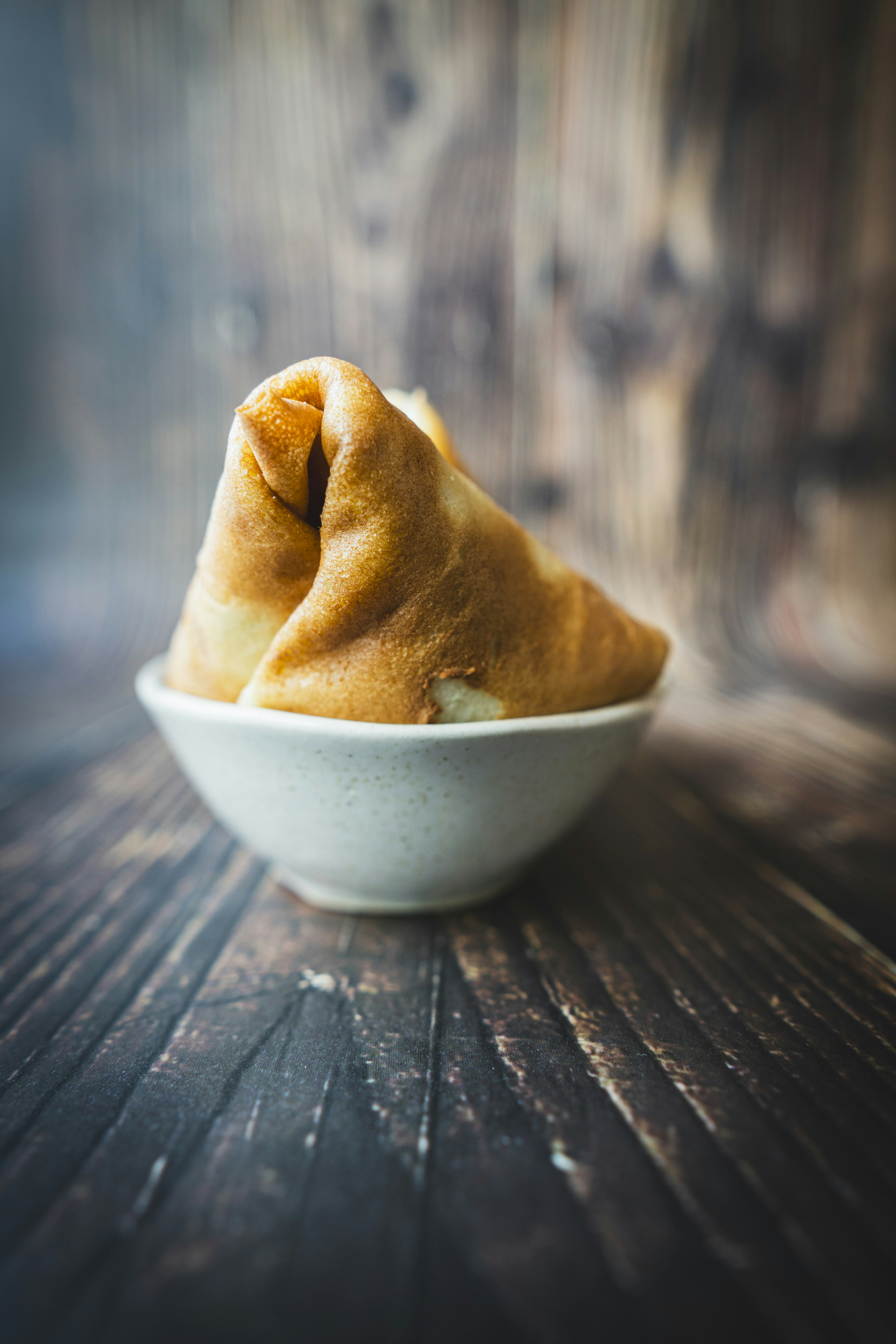 A bowl of food on a wooden table