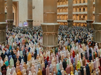 A large group of people standing in front of a building
