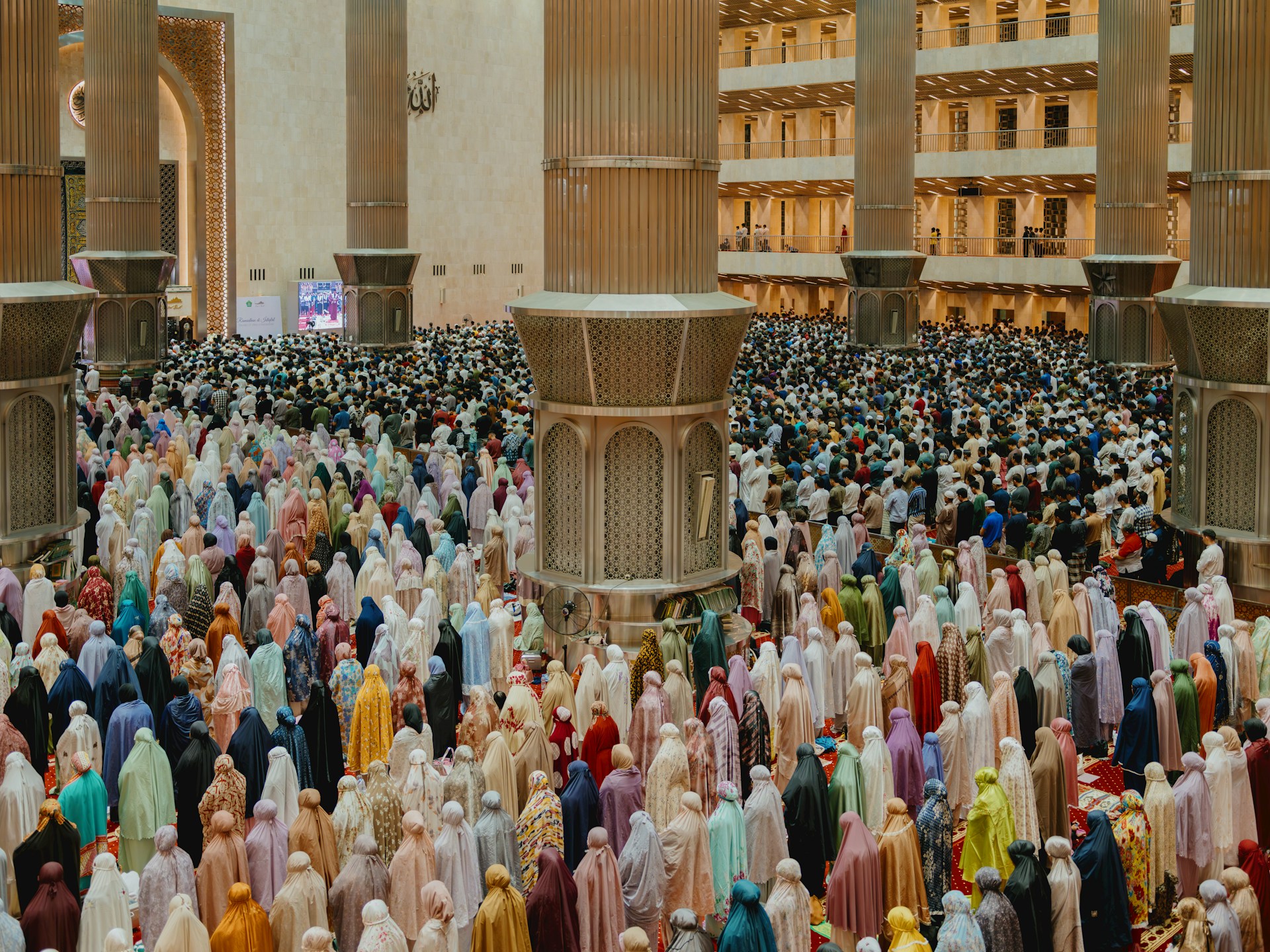 A large group of people standing in front of a building