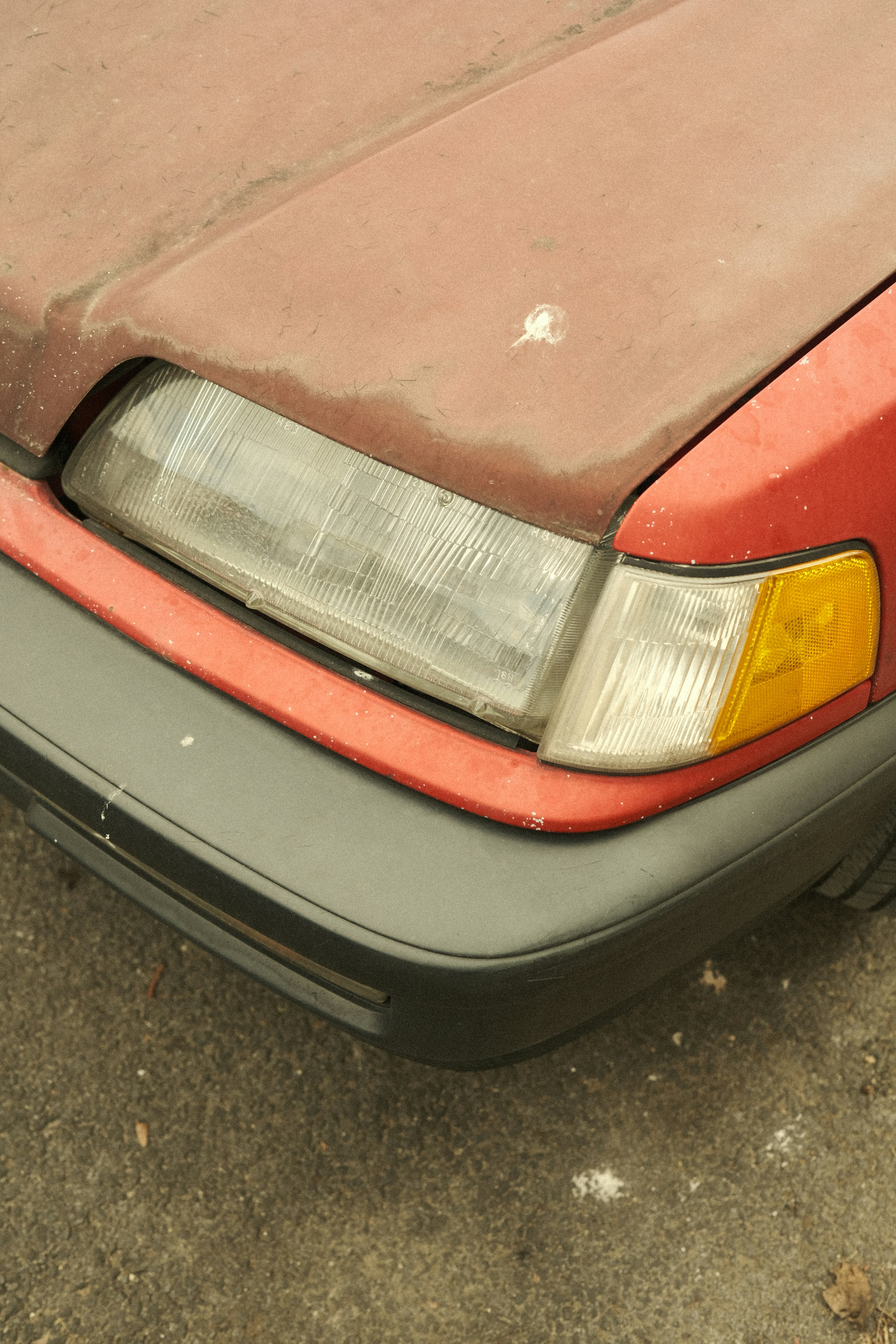A red car parked on the side of the road