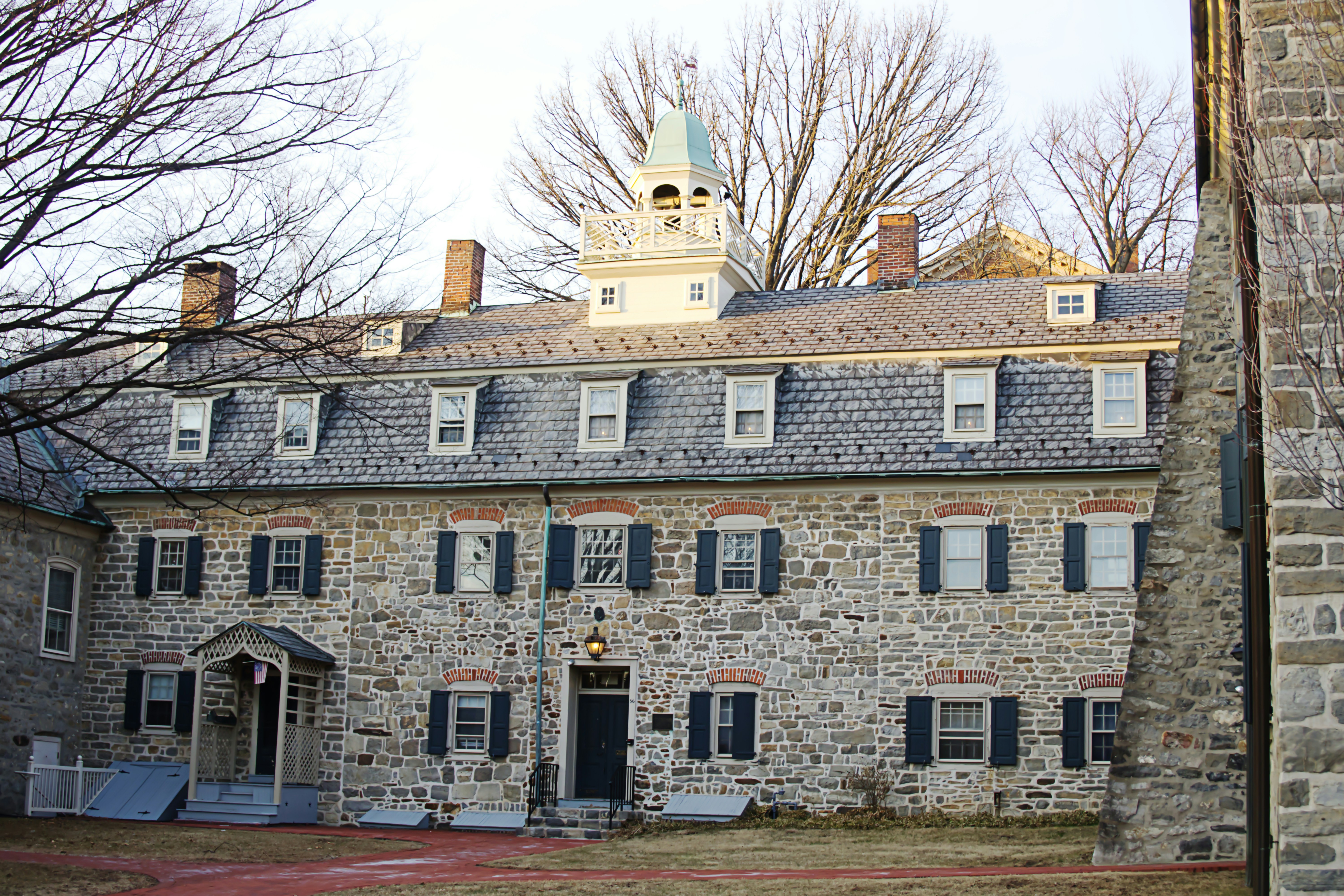 A historic stone building appears to be a dorm.