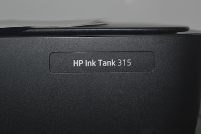 A close up of a hp ink tank