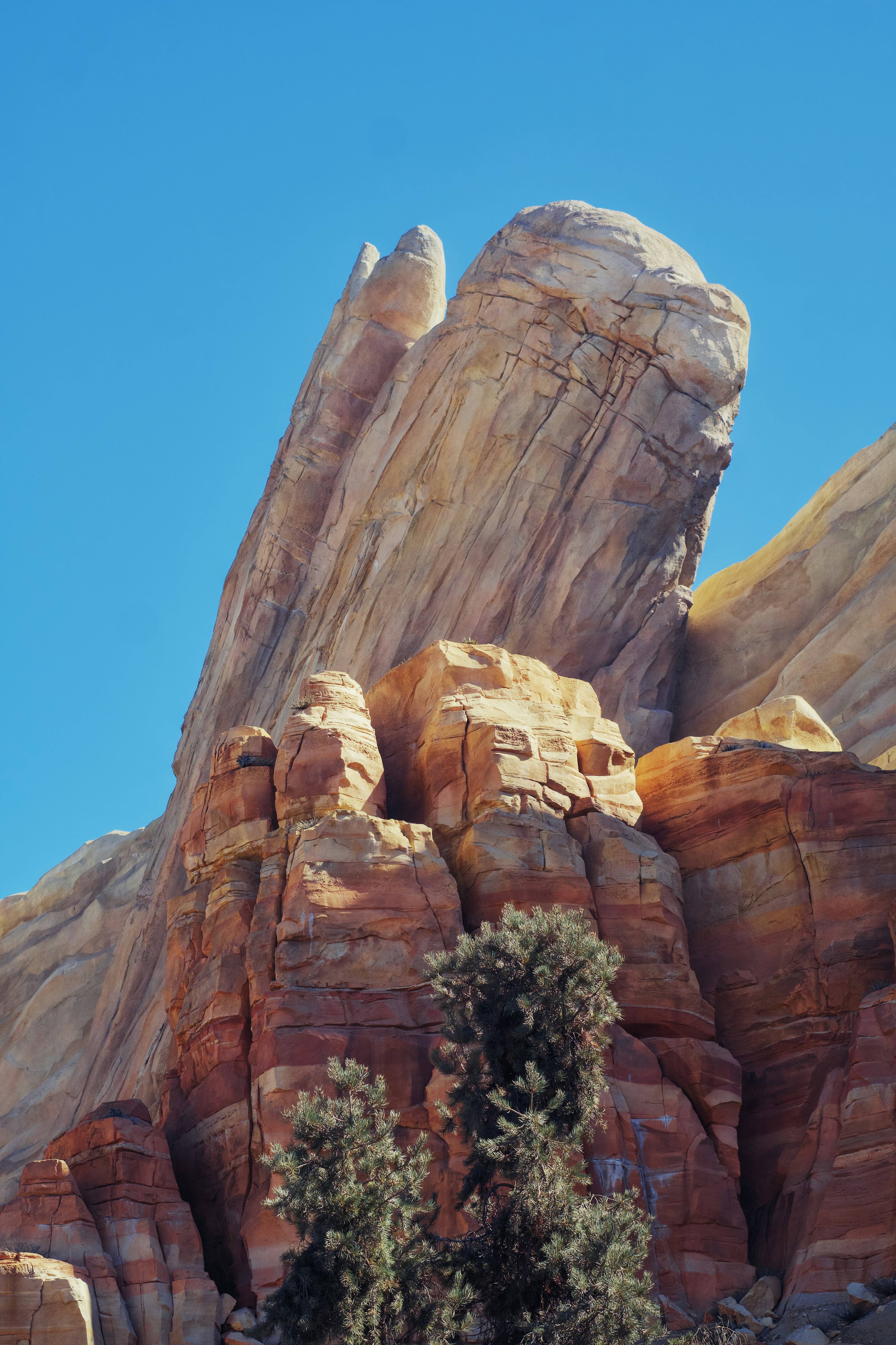 A large rock formation in the middle of a desert