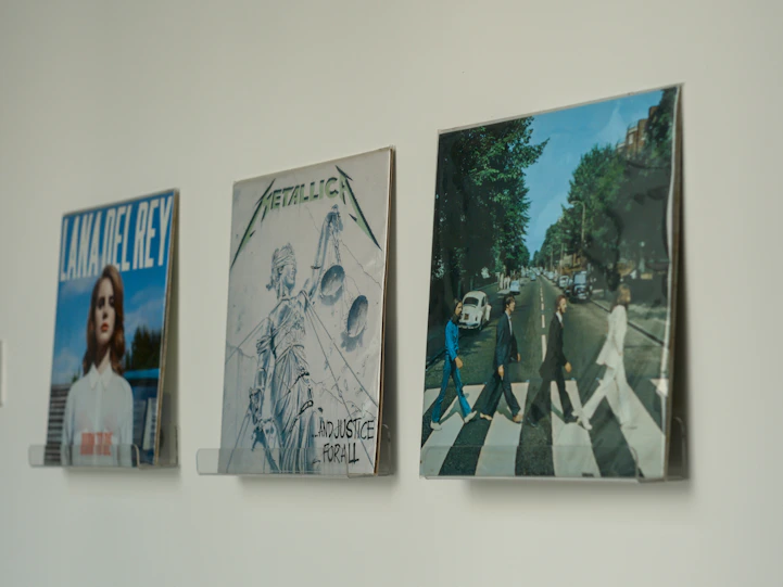 A wall with a bunch of pictures hanging on it