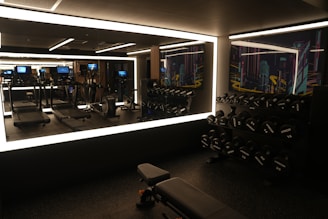 A gym with a mirror and a treadmill