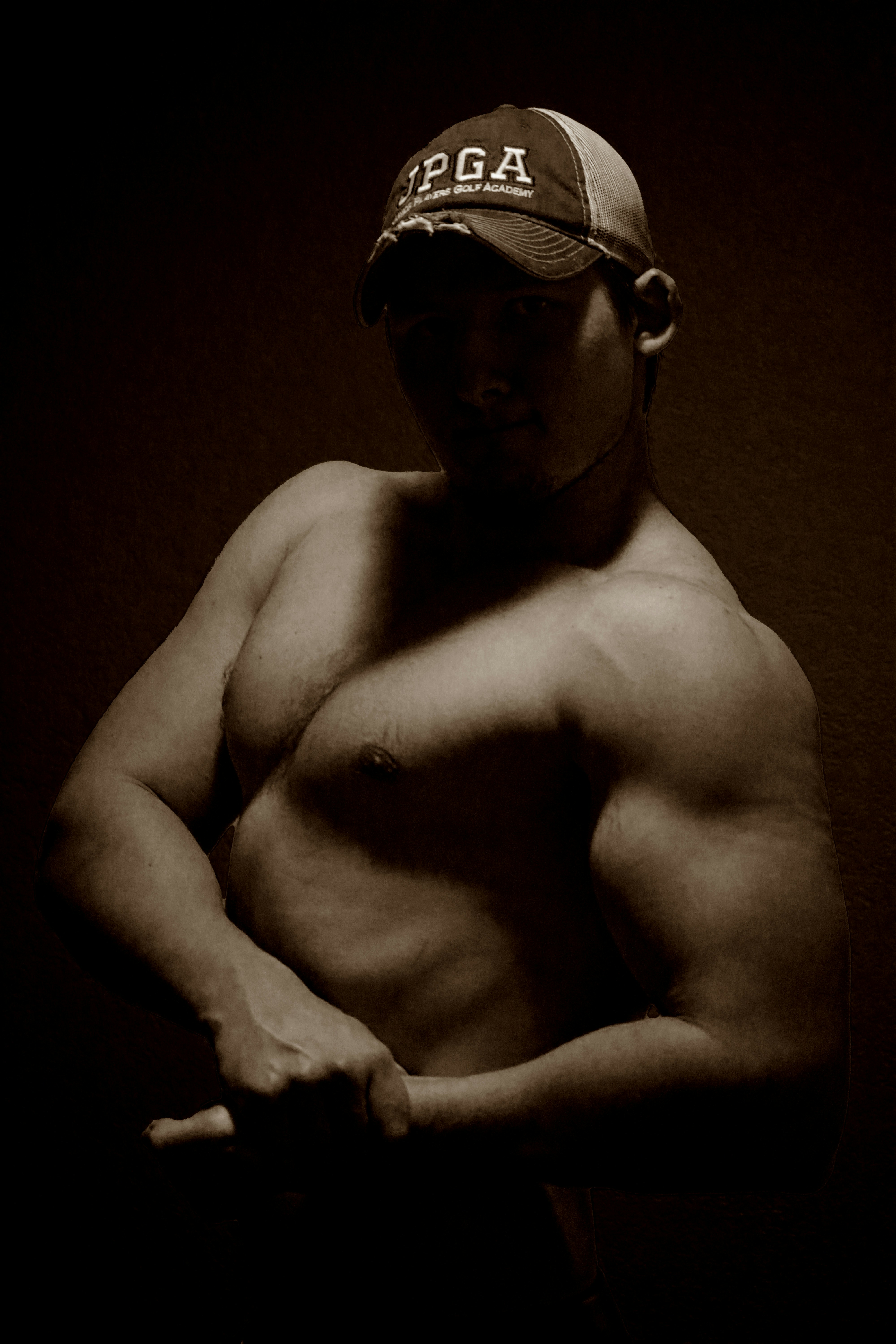 A black and white photo of a shirtless man