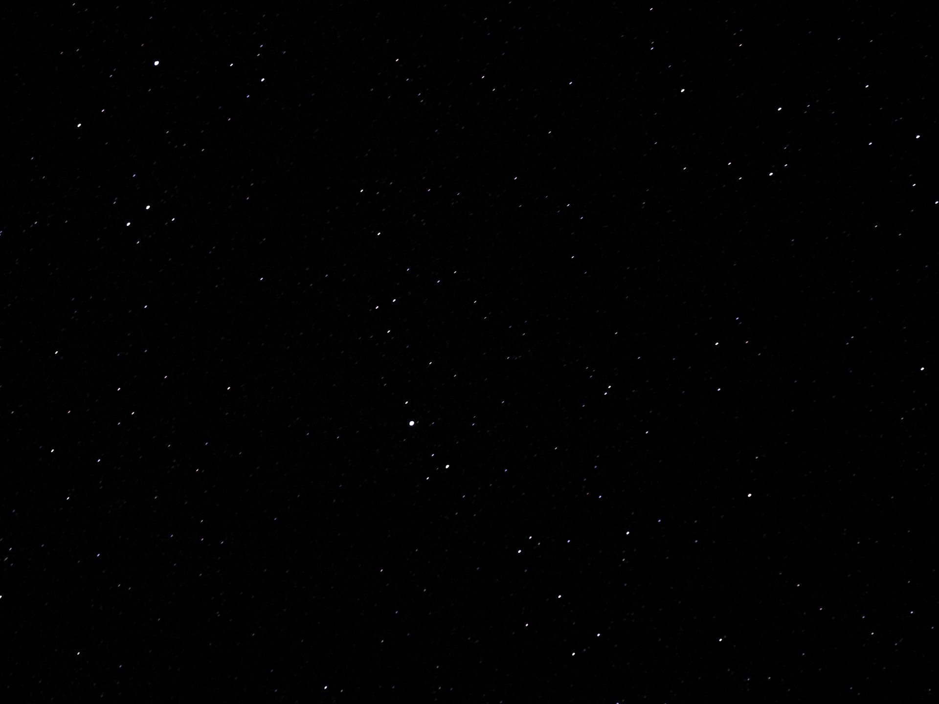 A black and white photo of the night sky