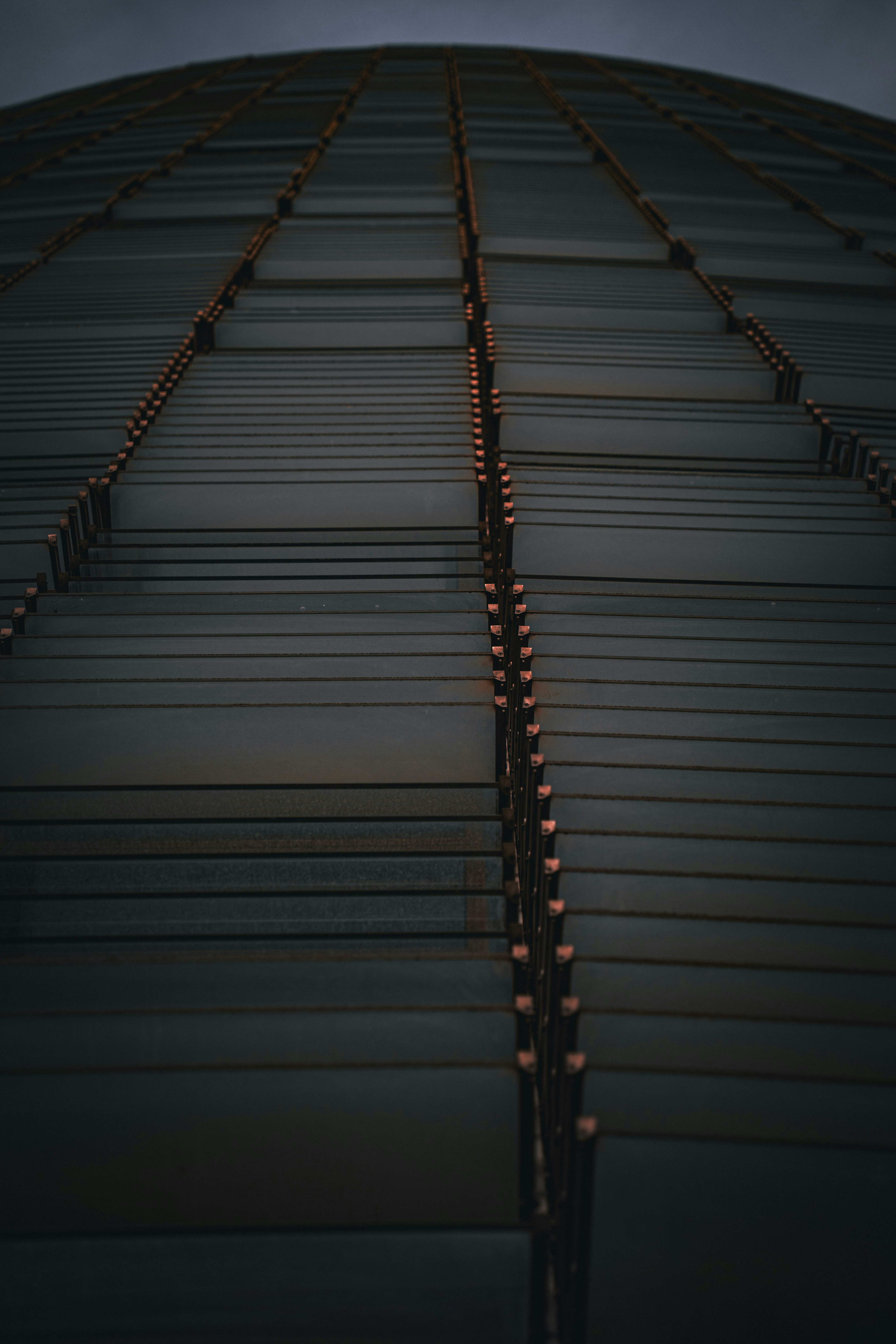 A very tall building with a sky in the background