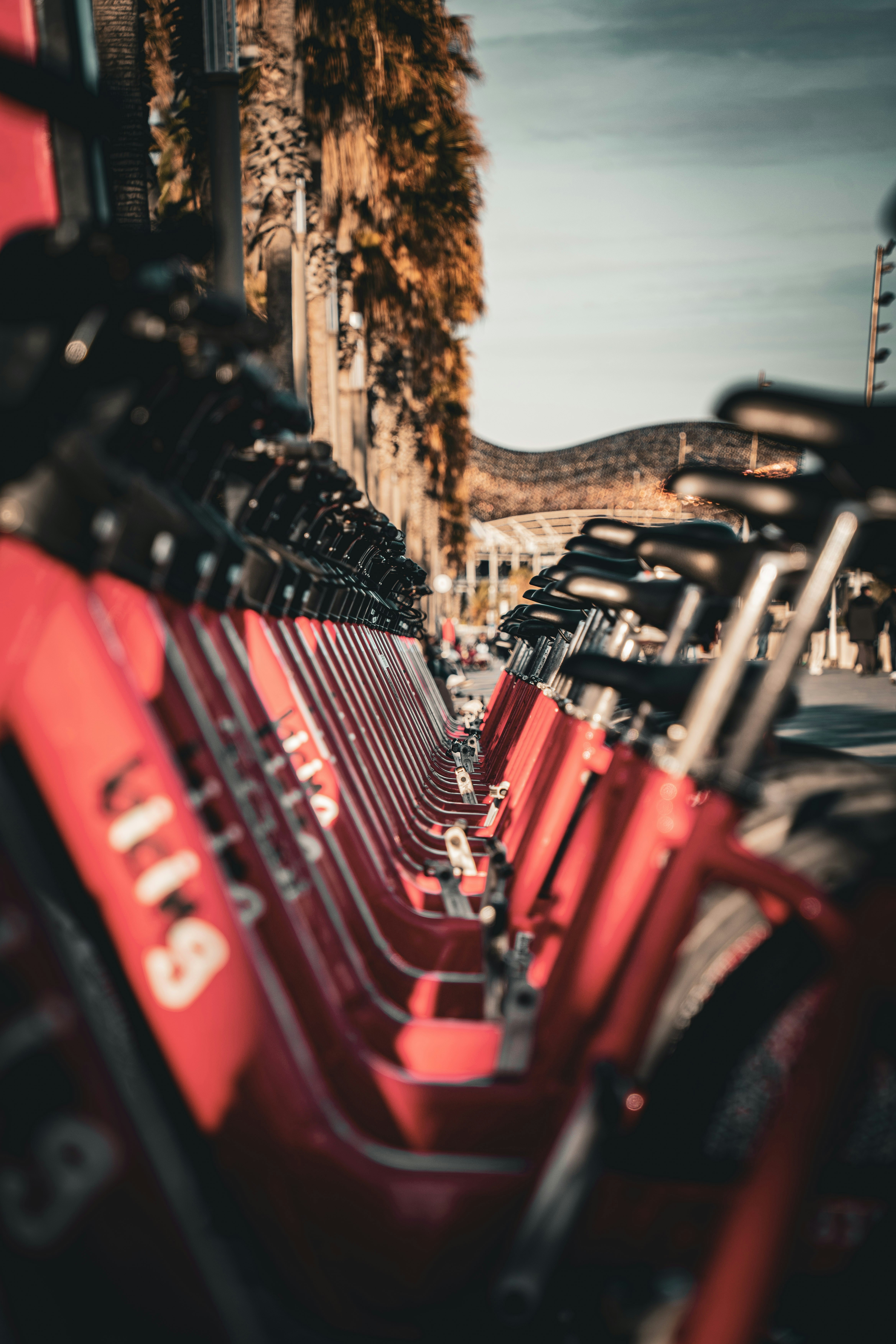 A row of red benches sitting next to each other