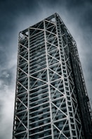 A tall building under a cloudy sky
