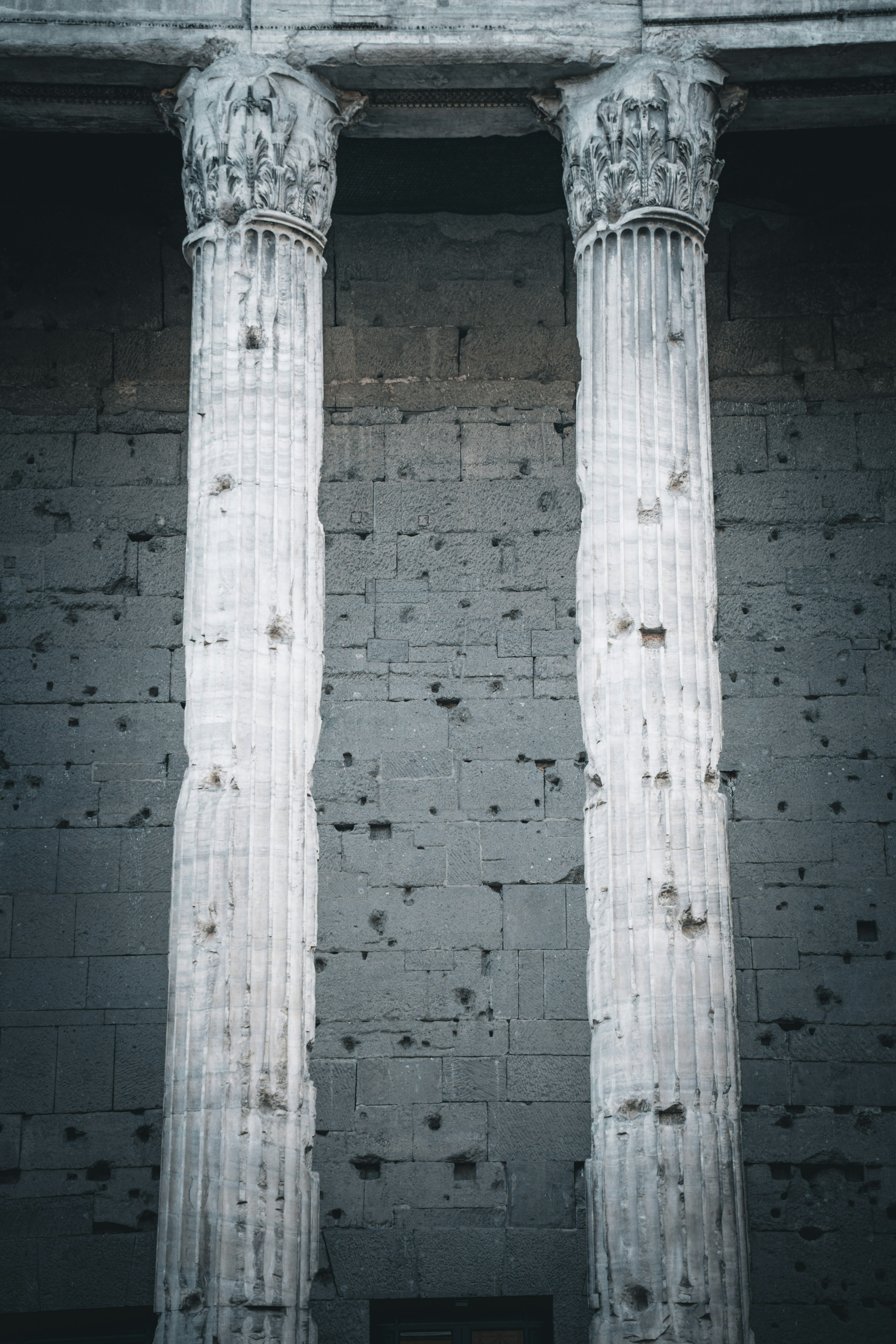 A couple of white pillars sitting next to each other