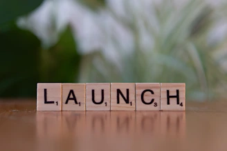 A scrabble block spelling out the word launch