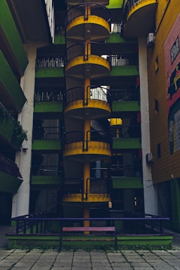 A very tall building with a bunch of balconies