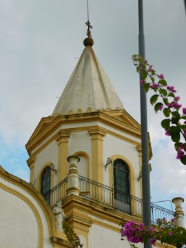 A tall building with a clock on it's side
