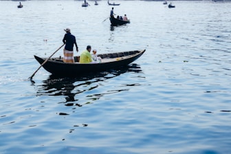 A group of people riding on the back of a boat