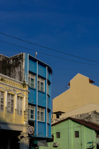A street sign in front of a row of buildings