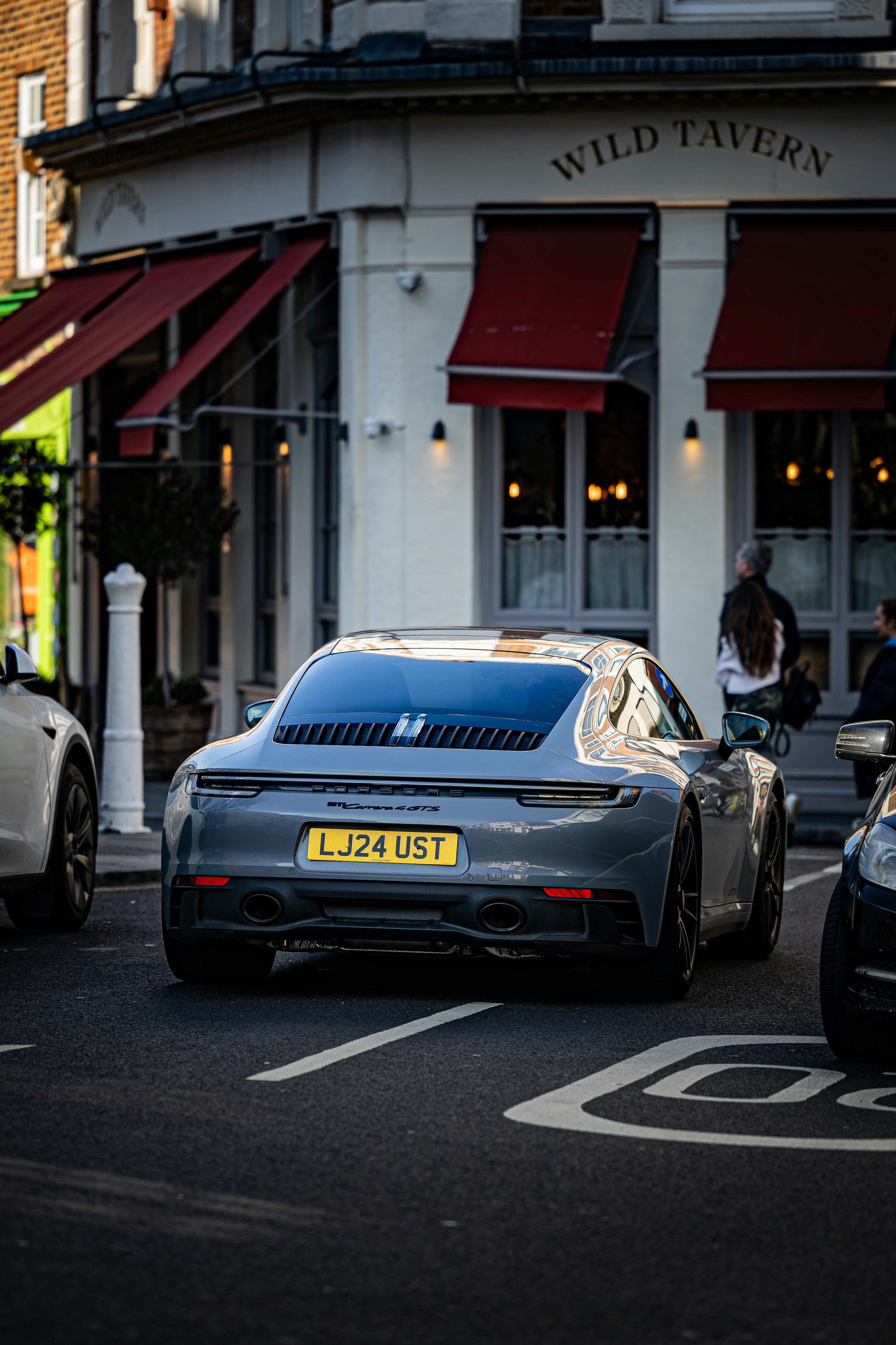 A couple of cars that are sitting in the street