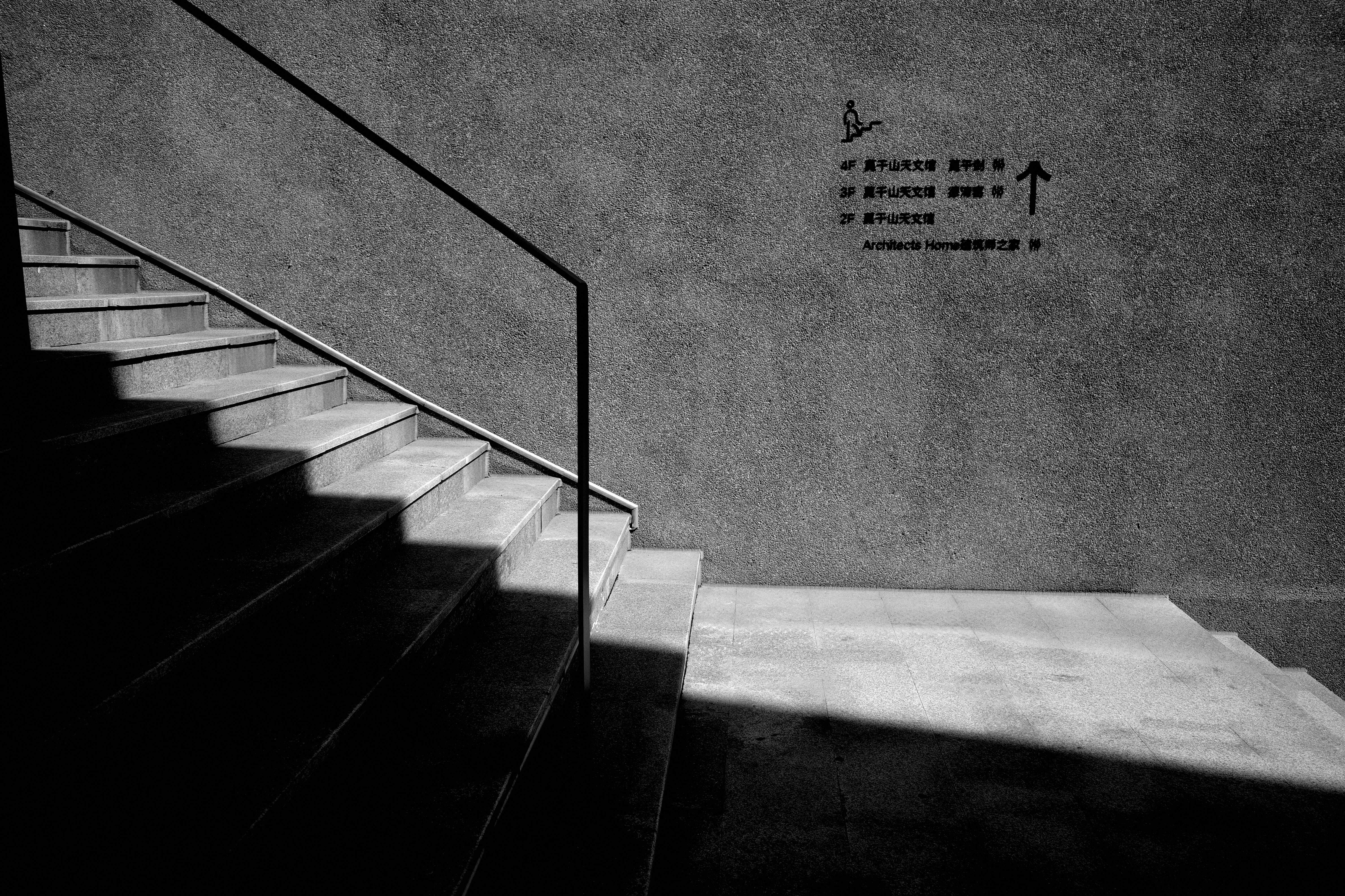 Stairs, handrail, and directions.