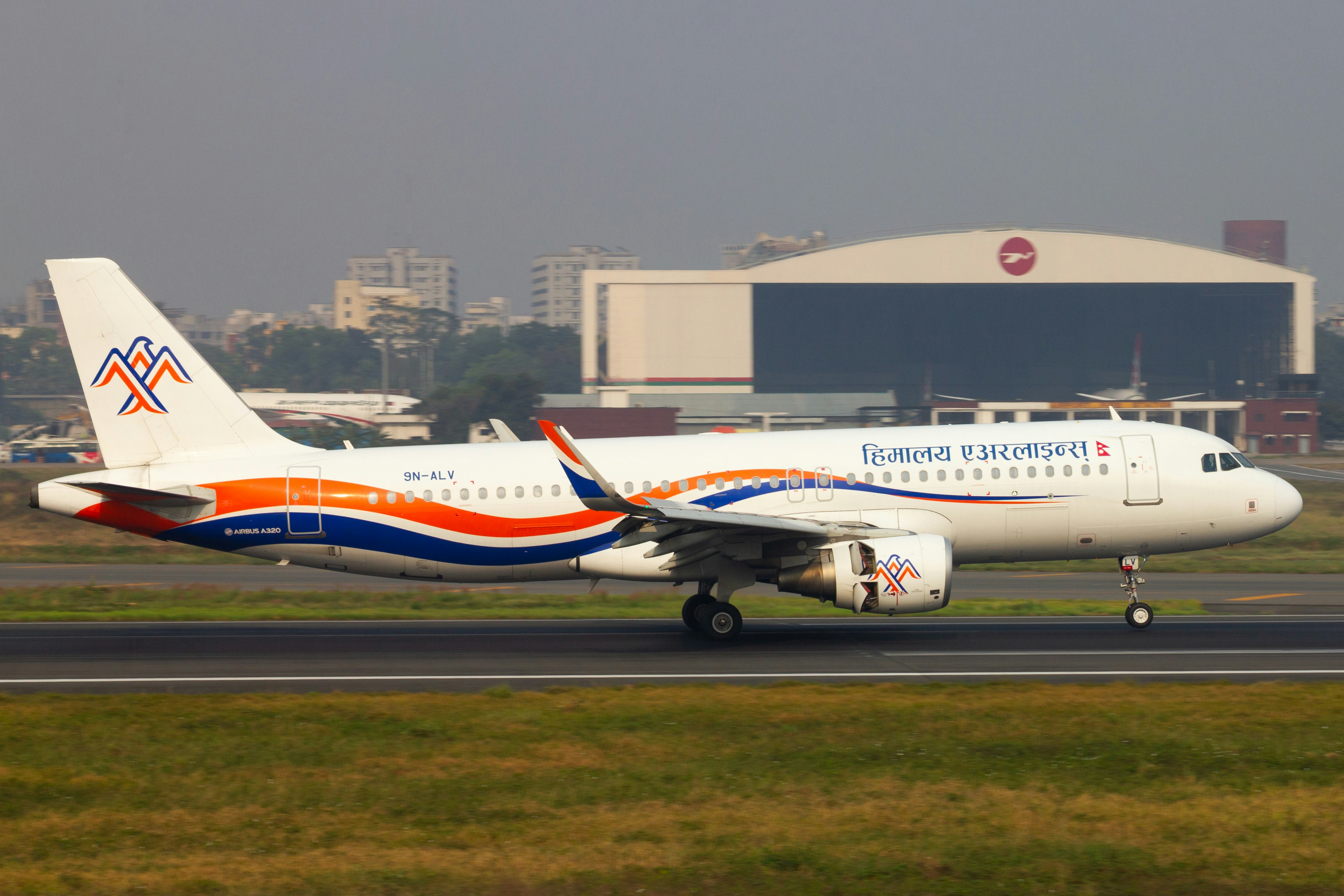 An airplane is sitting on the runway.