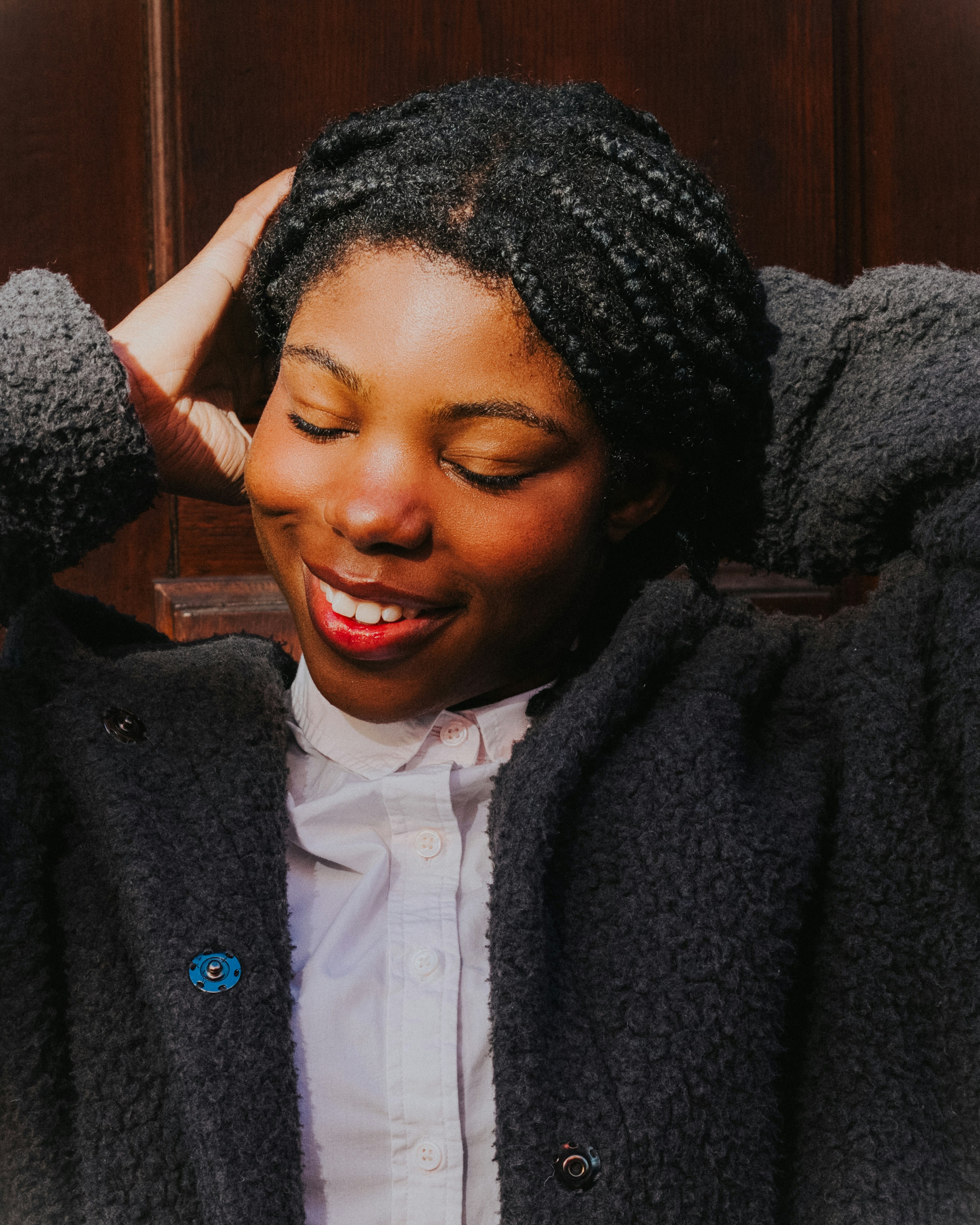 A woman in a white shirt and a black jacket