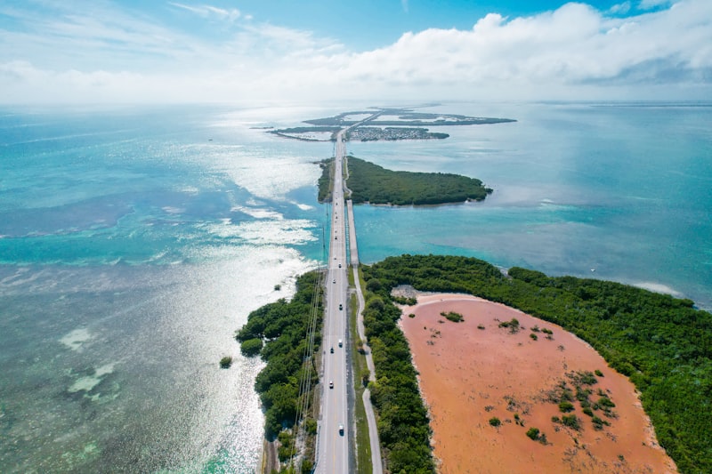 An aerial view of a highway near the ocean