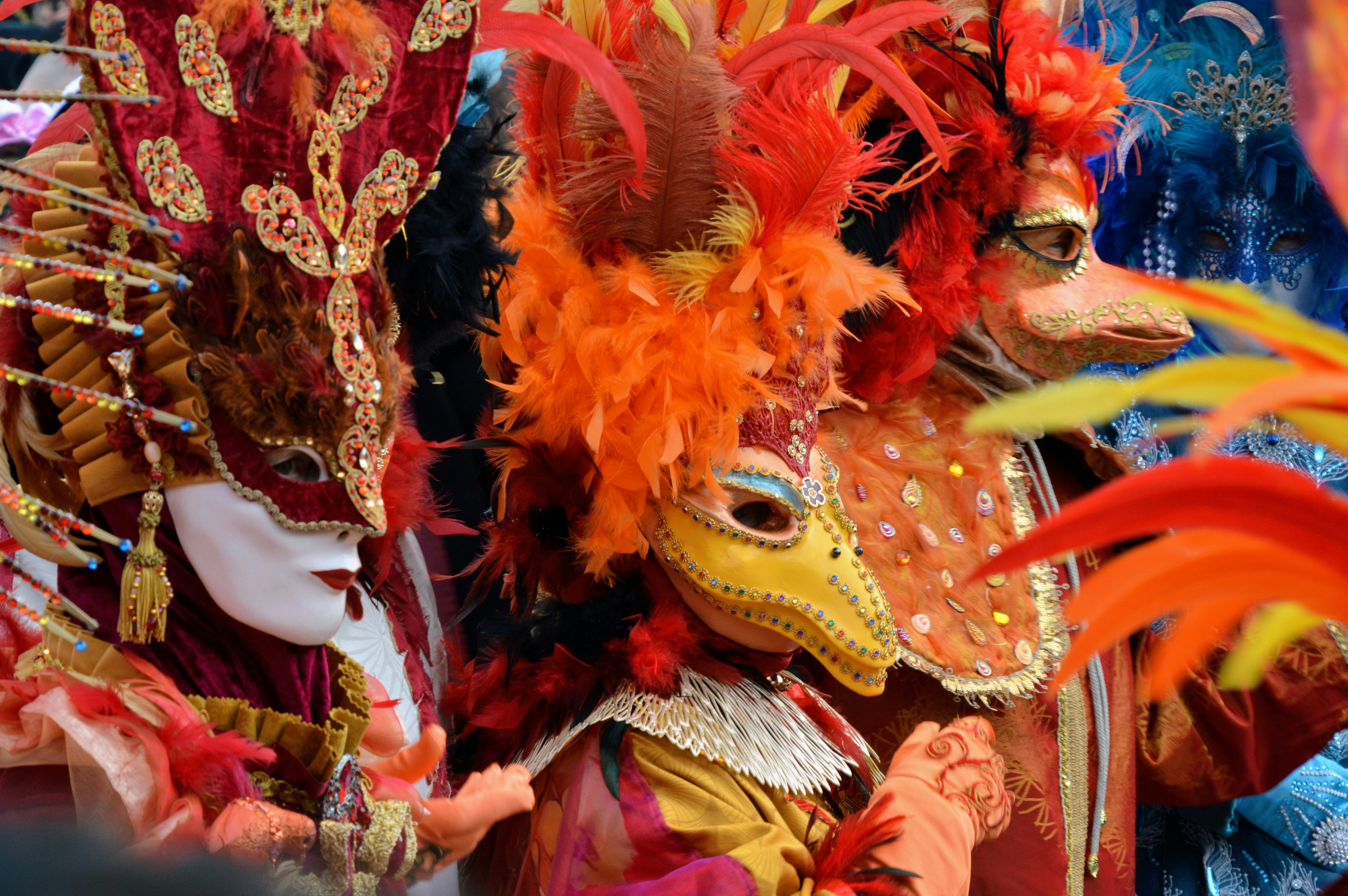 People in colorful costumes are celebrating a festival.