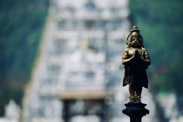 A statue standing before a temple