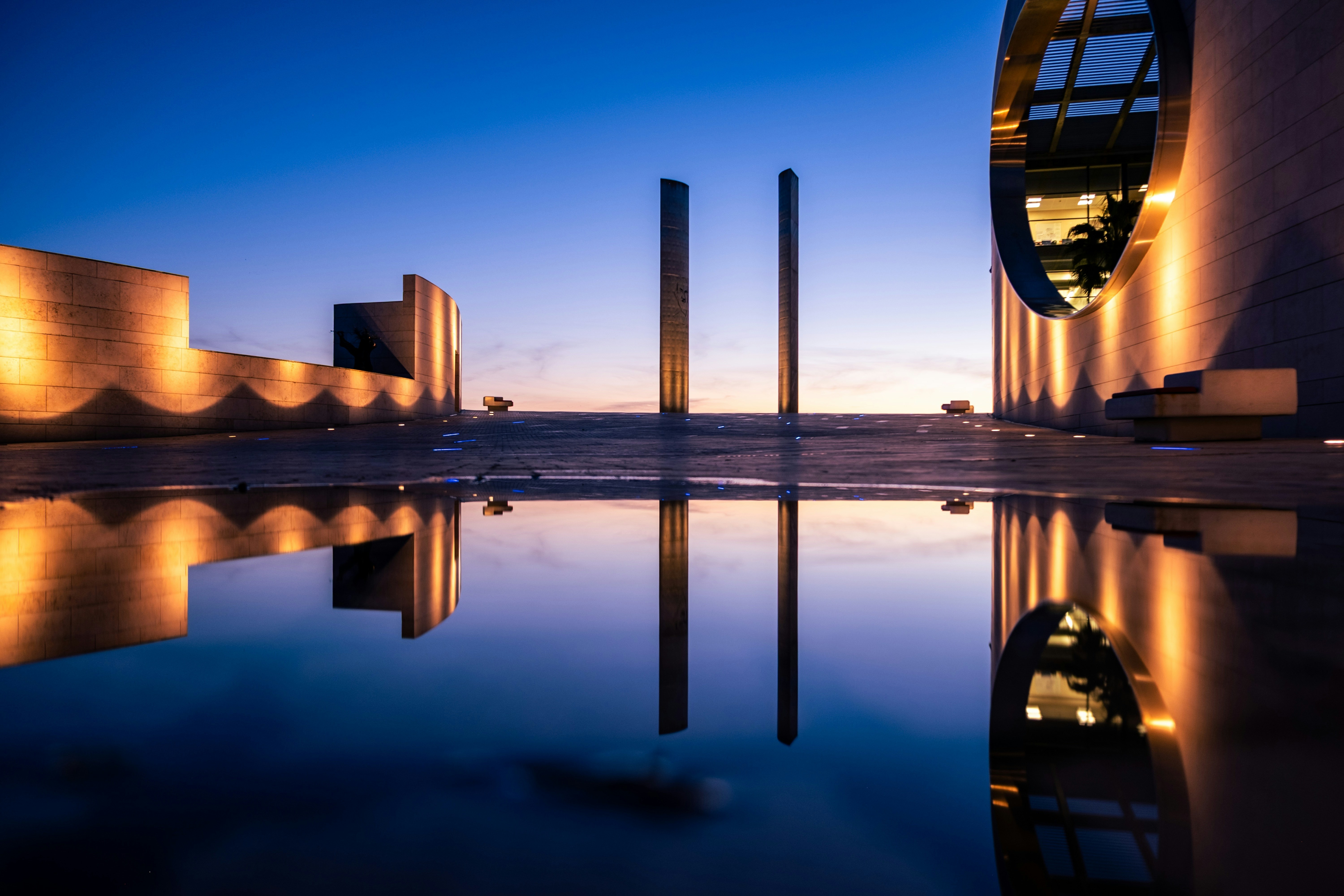 Modern architecture reflects beautifully in the water.