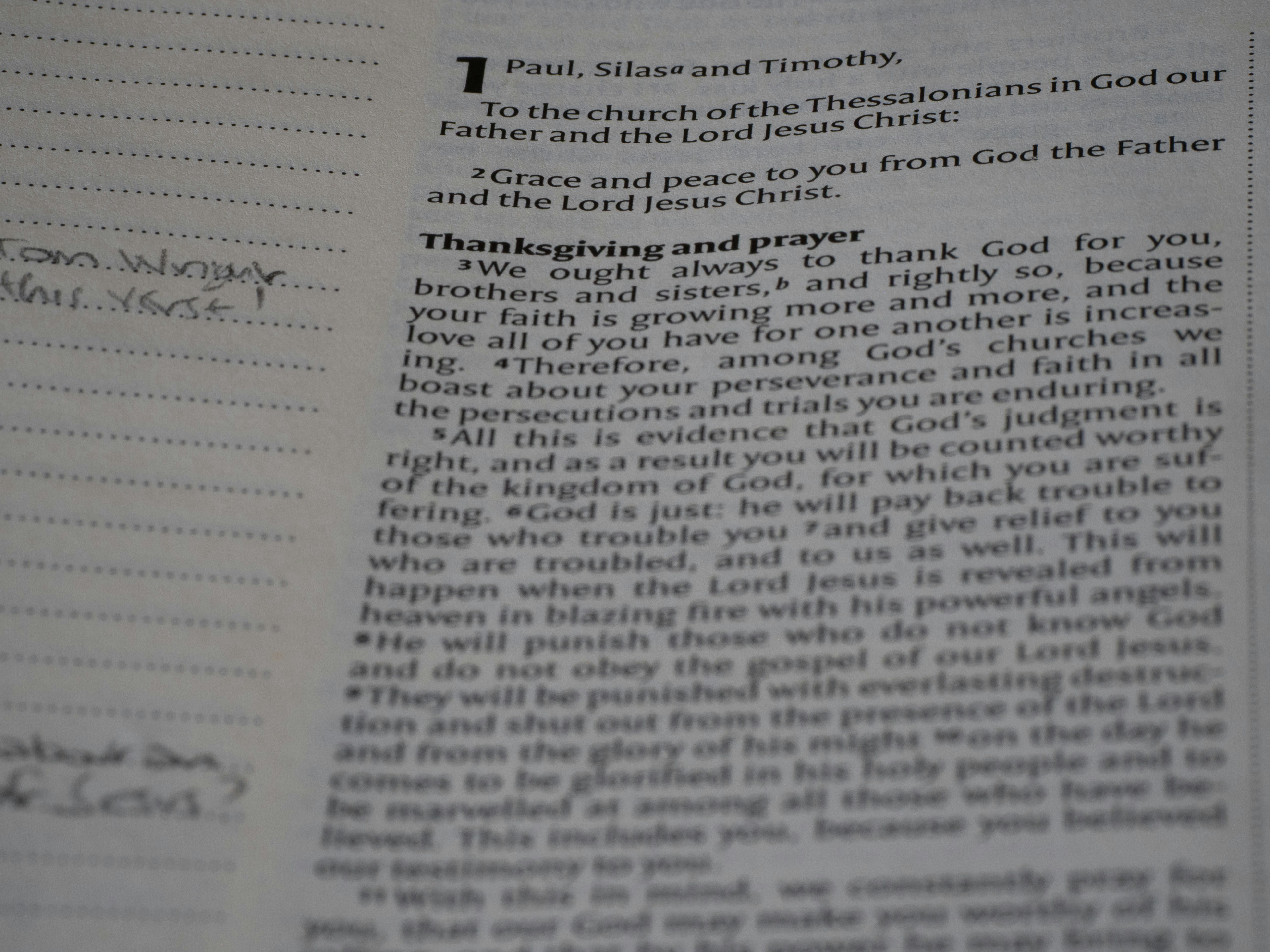 A close up of an open book with writing on it