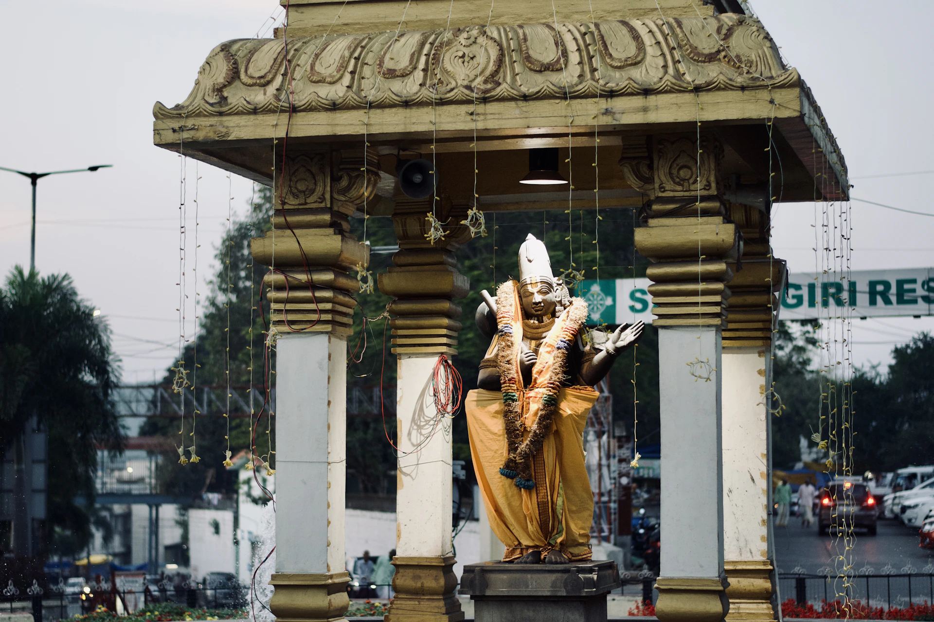 Statue of a deity is under a canopy