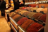 Spices are displayed at a market.