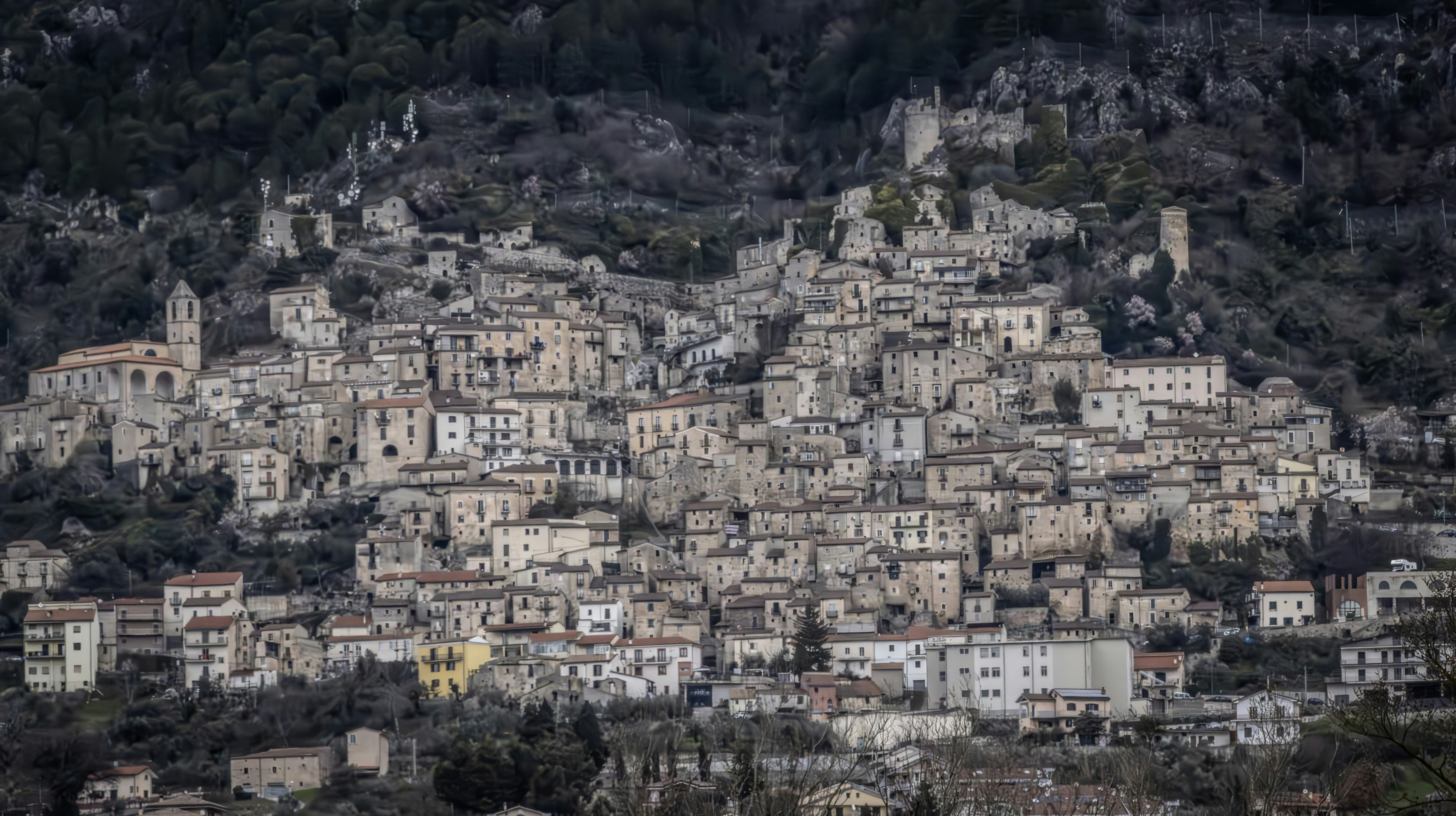 A hillside town showcases unique architectural designs., 