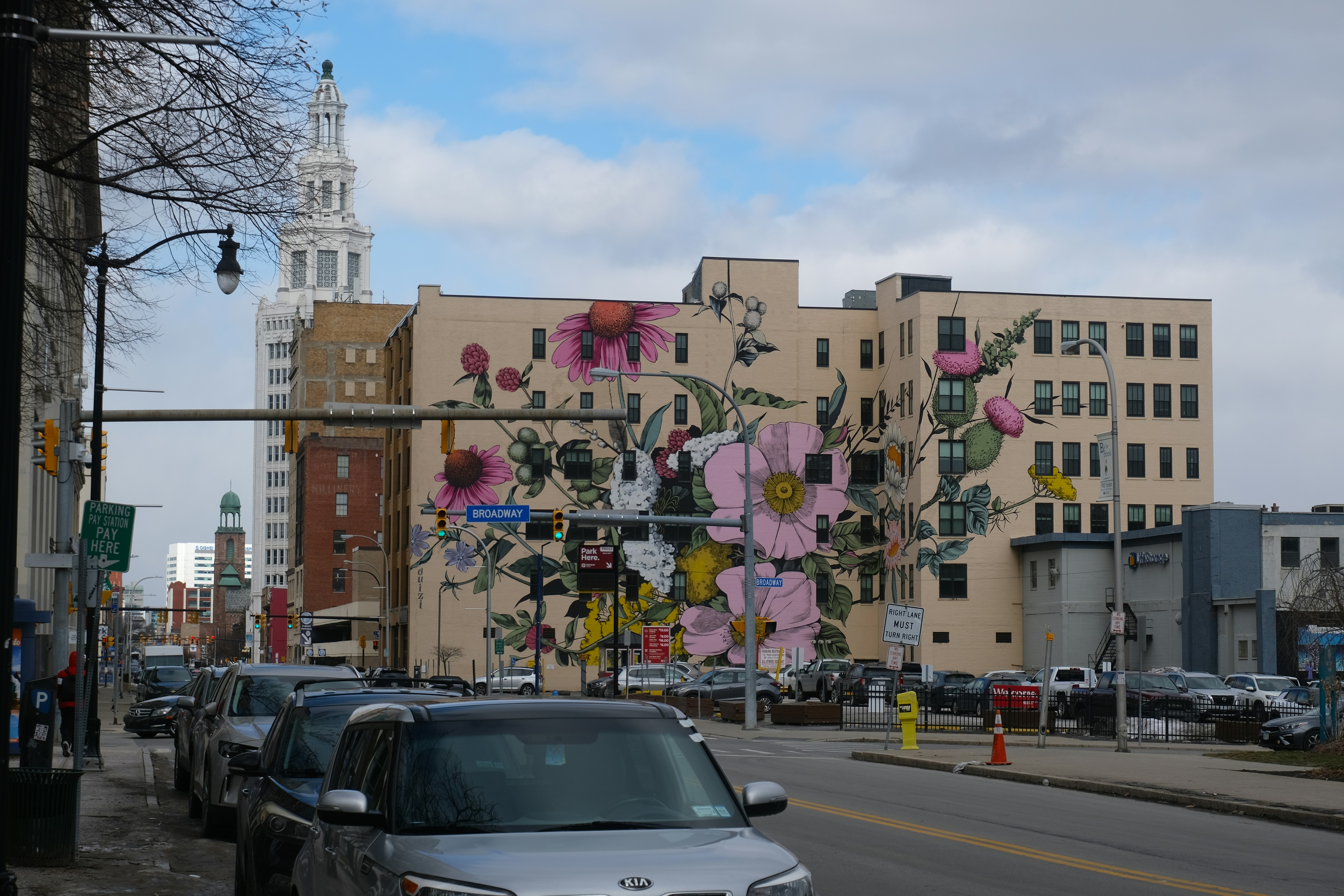 A vibrant street scene in Chicago's Pilsen neighborhood with colorful murals and local shops - Chicago apartment search