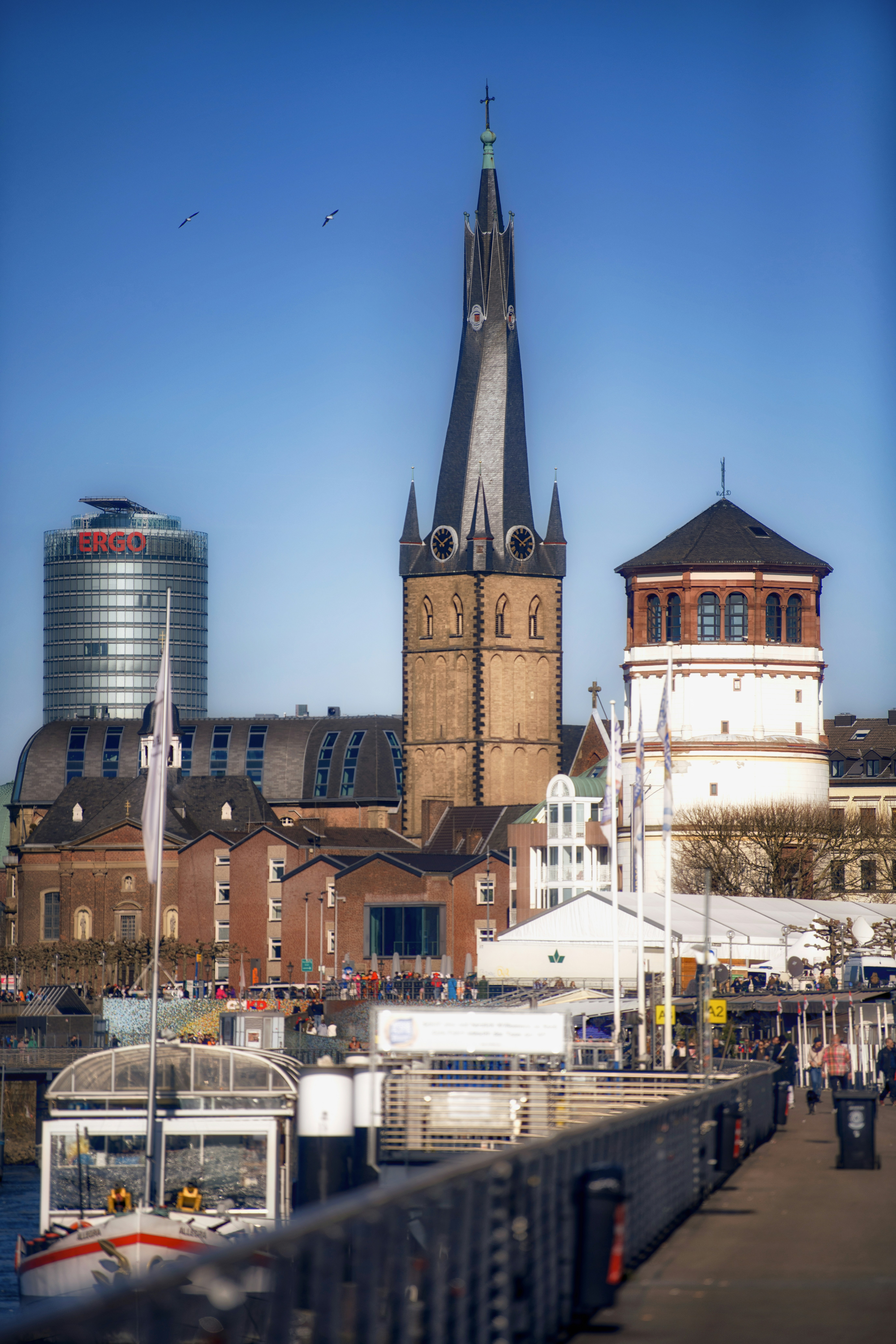 Dusseldorf's skyline with a tall church steeple.
