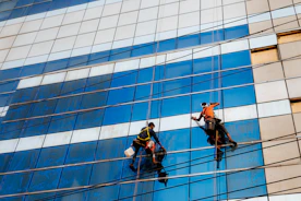 Window washers are cleaning a tall building.