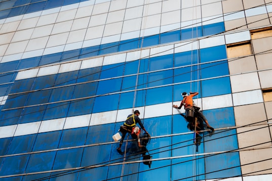 Window washers are cleaning a tall building.