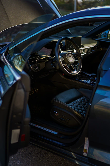 The interior of a luxurious audi car.