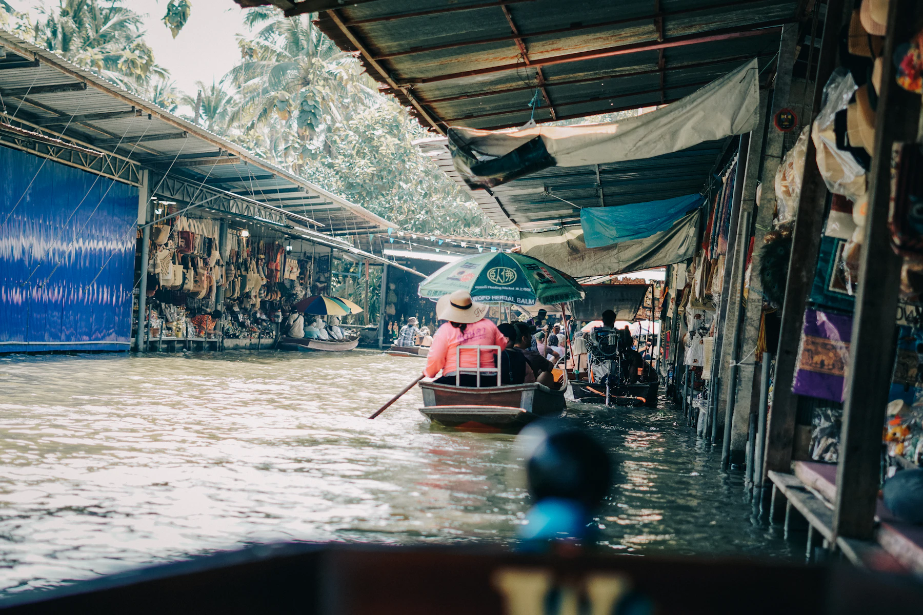 A boat loaded with produce at a floating market