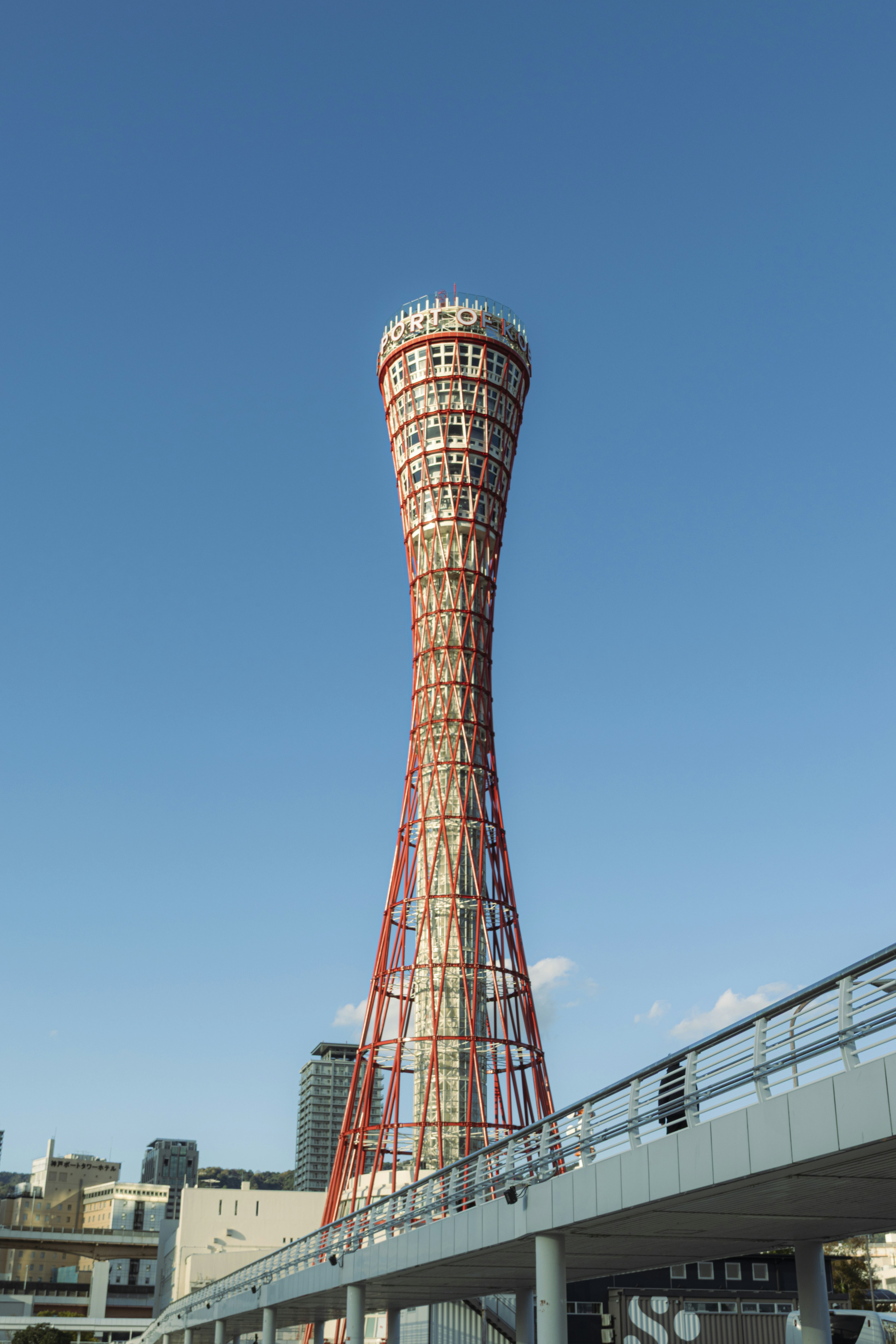 Kobe port tower stands tall against a blue sky.
