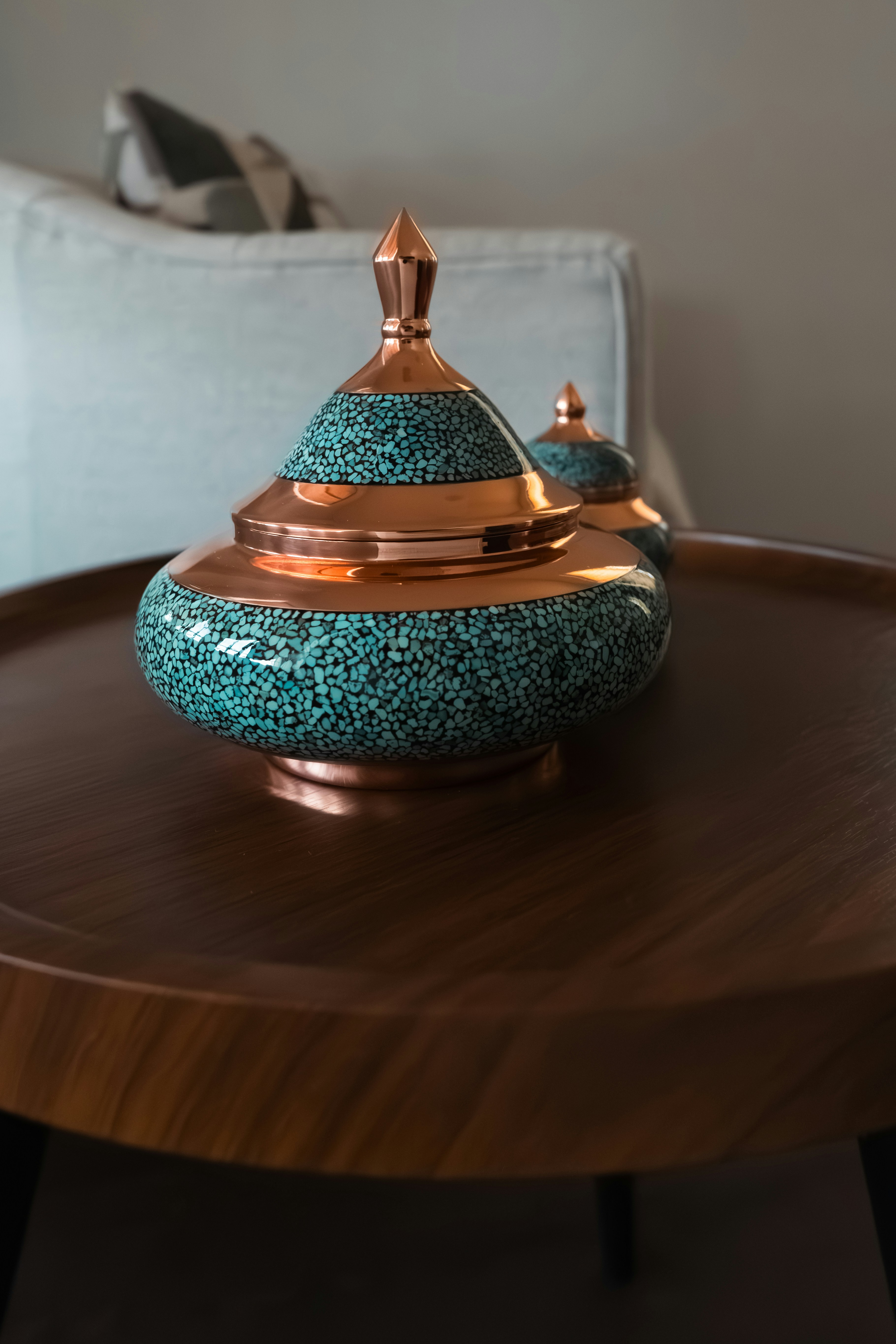 Decorative jars sit on a wooden coffee table.