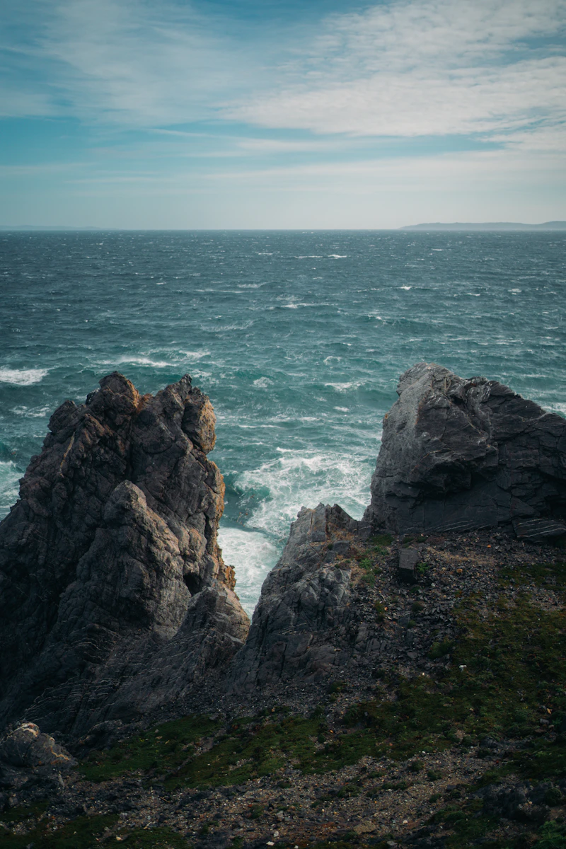 Rugged cliffs facing a stormy ocean