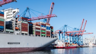 A cargo ship at a busy port.