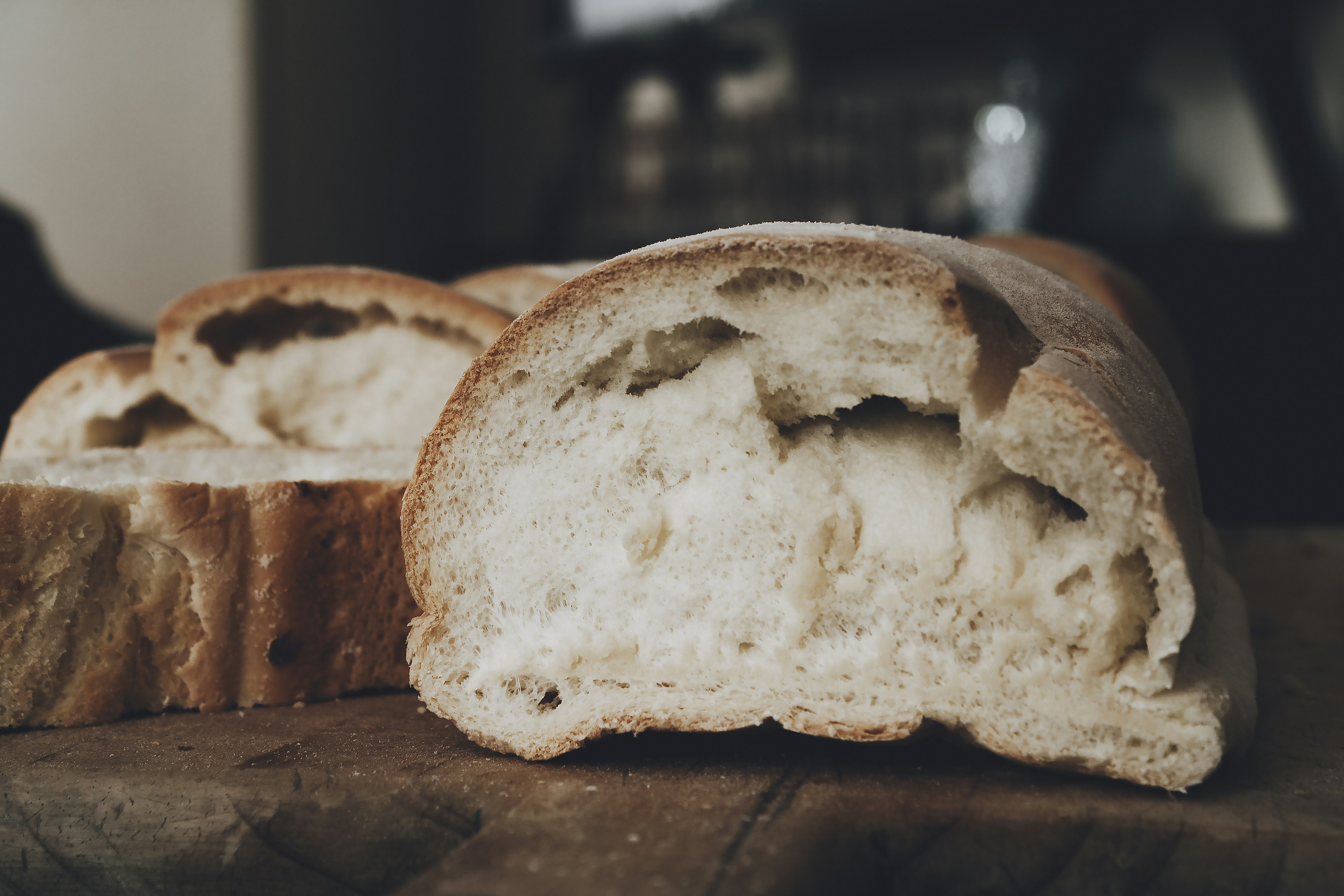 Sliced bread on wooden cutting board