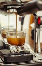 Espresso being poured into a glass.