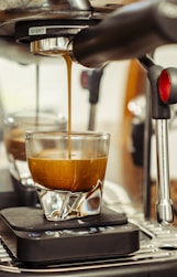Espresso being poured into a glass.